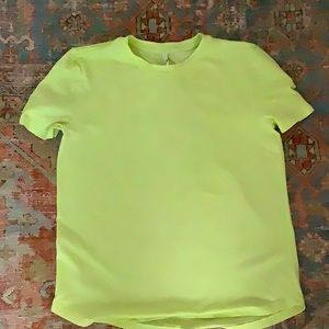 This is a lululemon lime colored shirt.